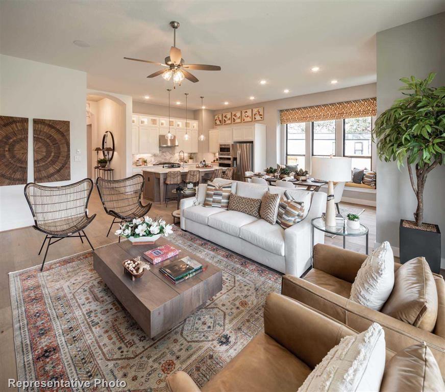 Family Room (Representative Photo) - If you have additional questions regarding 14951 Royal Glen Trace  in Conroe or would like to tour the property with us call 800-660-1022 and reference MLS# 49149379.