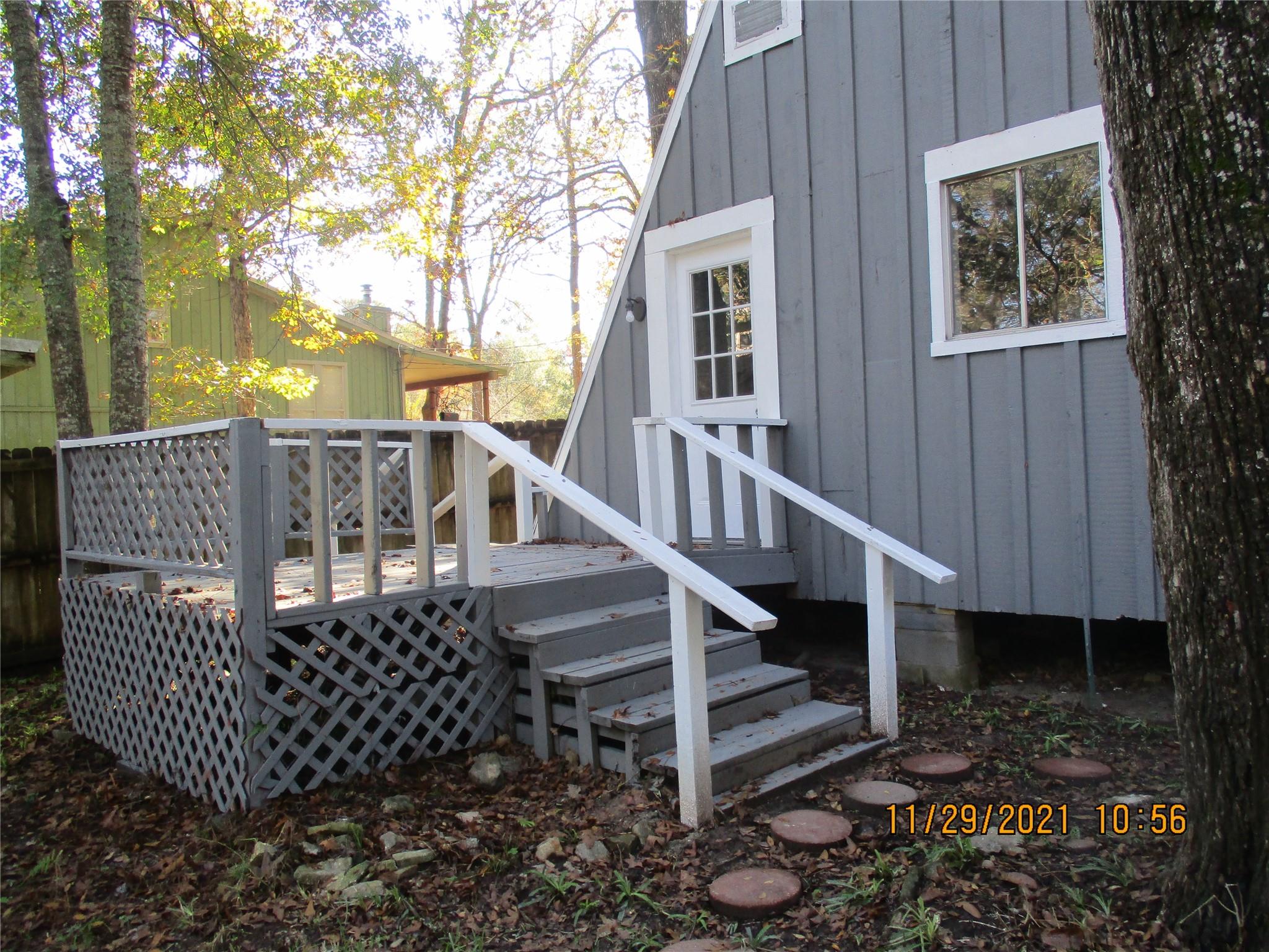Steps up to Back Porch - If you have additional questions regarding 105 Lazy Trail  in Conroe or would like to tour the property with us call 800-660-1022 and reference MLS# 89335860.