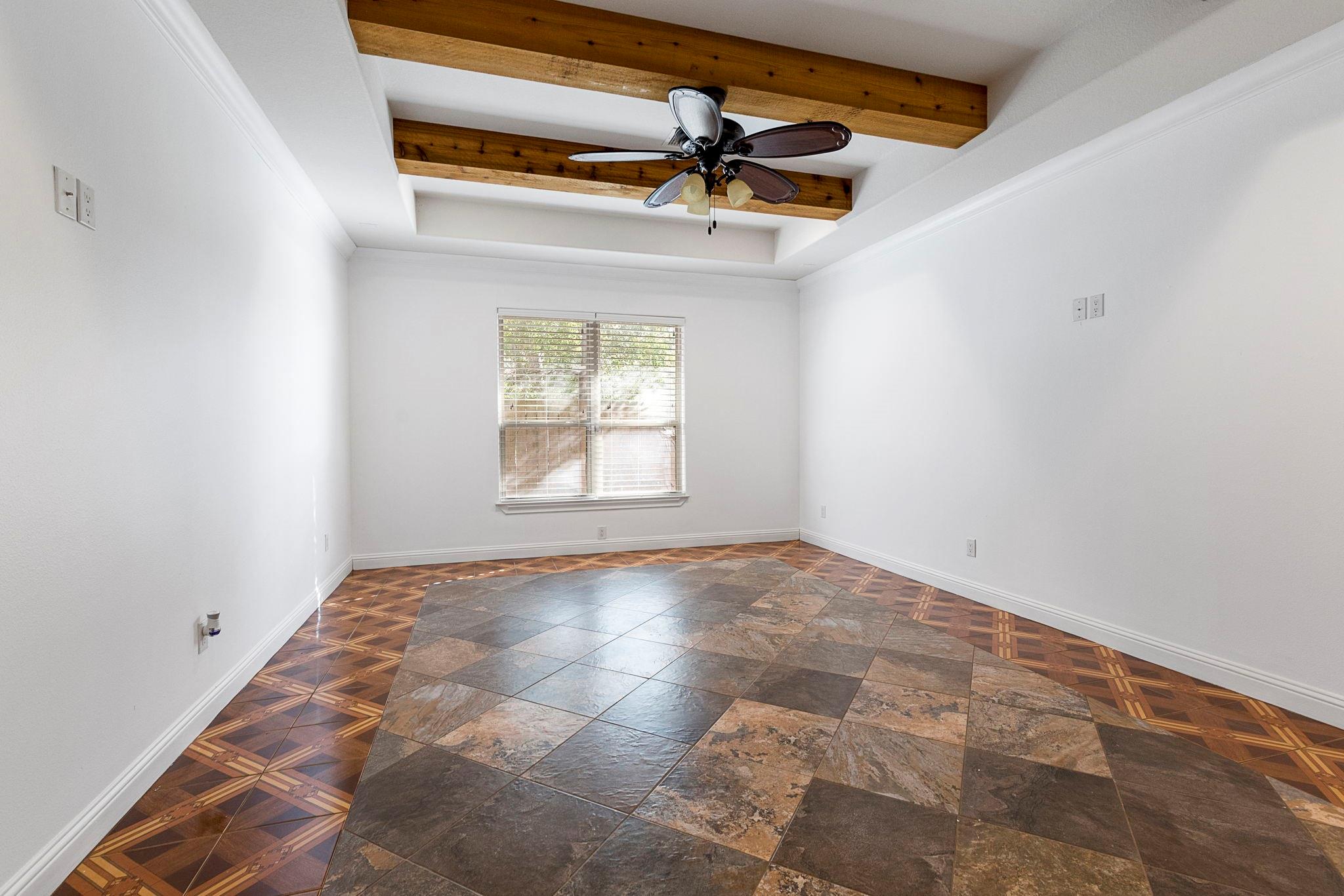 Texas sized master bedroom with exposed wood beams - If you have additional questions regarding 1155 Whipporwill Road  in Conroe or would like to tour the property with us call 800-660-1022 and reference MLS# 12122183.