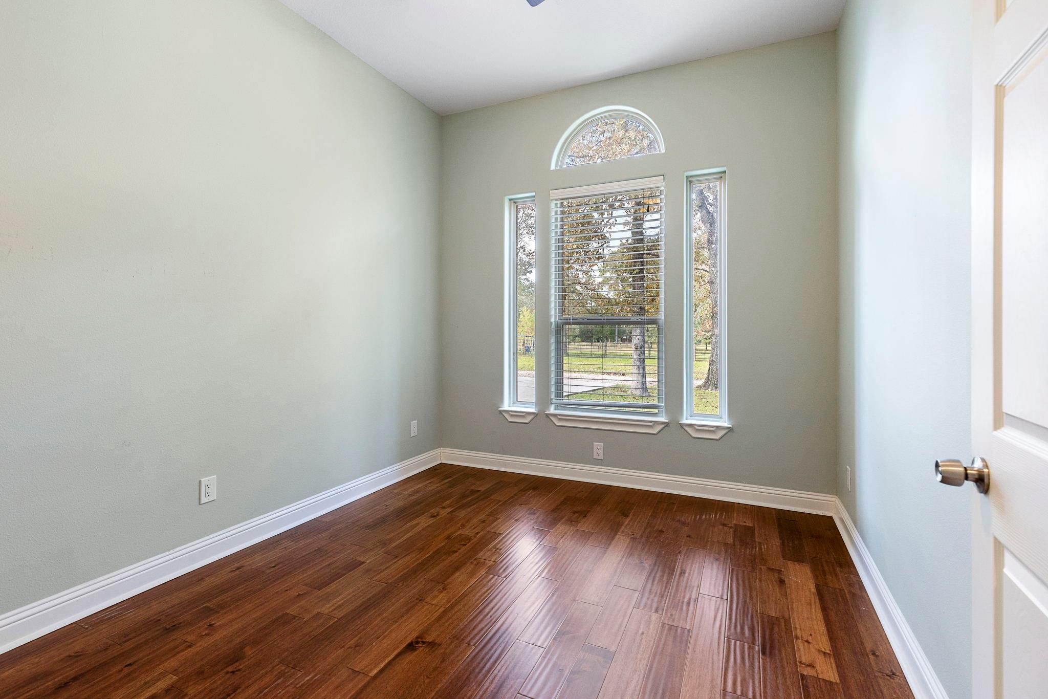 Another secondary bedroom located downstairs - If you have additional questions regarding 1155 Whipporwill Road  in Conroe or would like to tour the property with us call 800-660-1022 and reference MLS# 12122183.