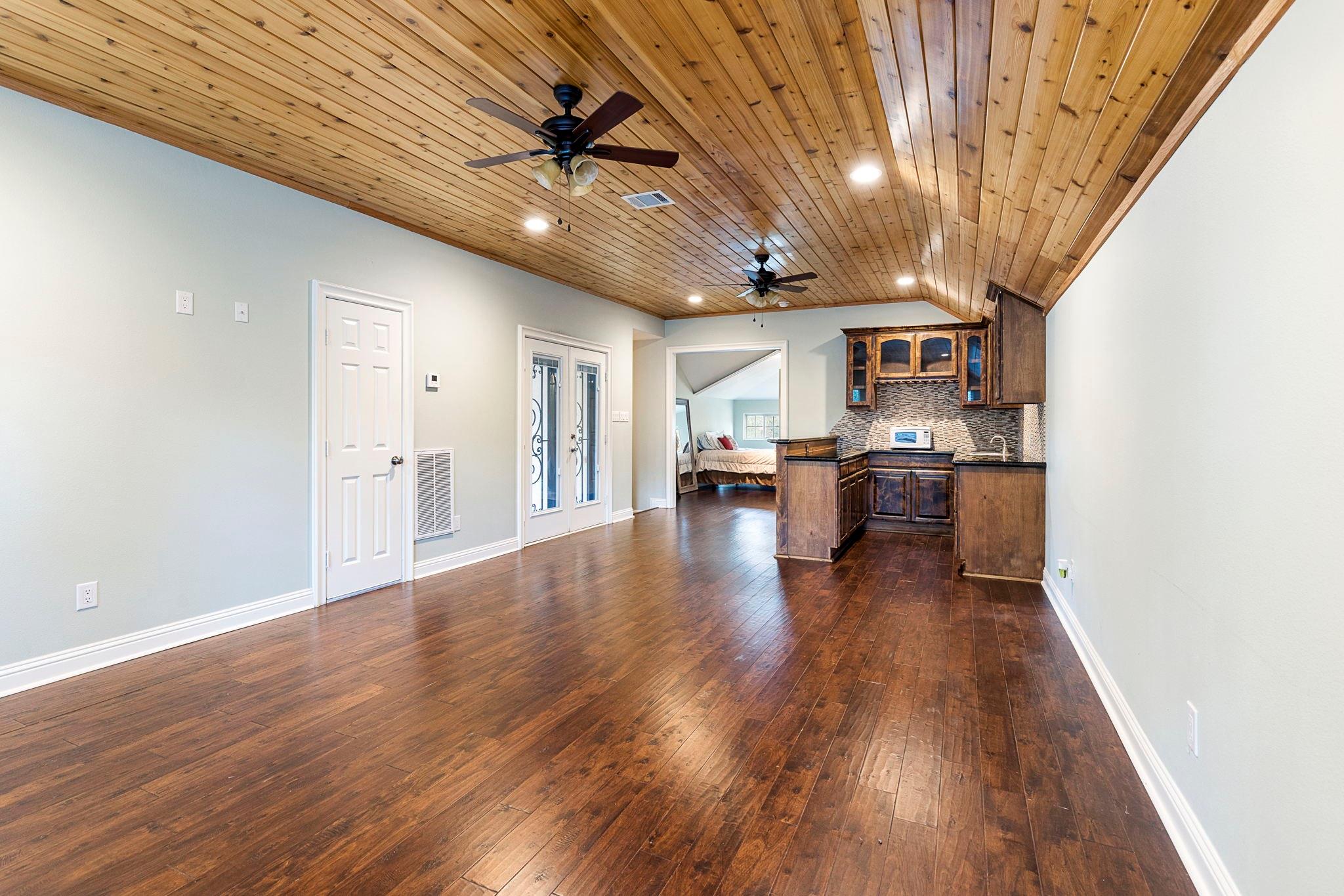 Media room/Game room with wet bar - If you have additional questions regarding 1155 Whipporwill Road  in Conroe or would like to tour the property with us call 800-660-1022 and reference MLS# 12122183.
