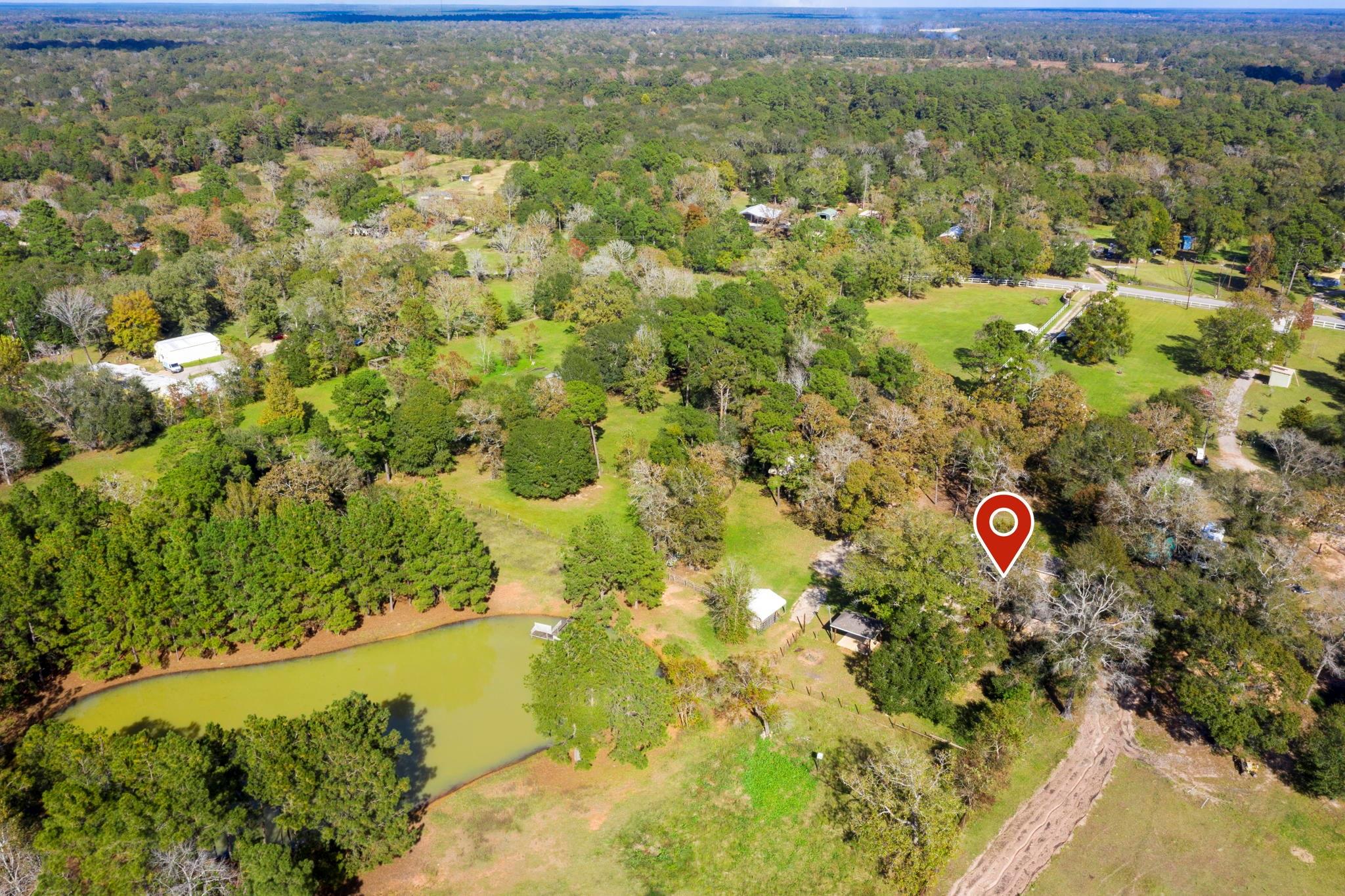 The home is located in the center of the property. - If you have additional questions regarding 1155 Whipporwill Road  in Conroe or would like to tour the property with us call 800-660-1022 and reference MLS# 12122183.