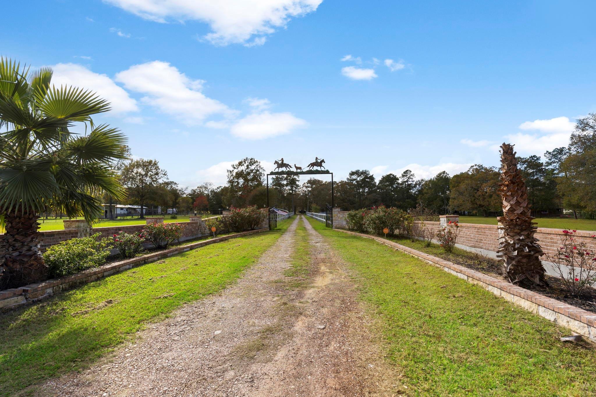 Landscaped Private Entrance - If you have additional questions regarding 1155 Whipporwill Road  in Conroe or would like to tour the property with us call 800-660-1022 and reference MLS# 12122183.
