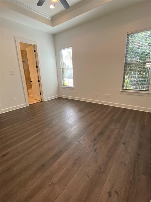 Primary bedroom with luxury plank flooring, tray ceiling, walk in closet and private full bathroom - If you have additional questions regarding 710 W Lockhart Street  in Kyle or would like to tour the property with us call 800-660-1022 and reference MLS# 5441365.