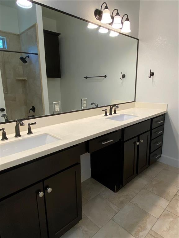 Private primary bathroom with dual sinks - If you have additional questions regarding 710 W Lockhart Street  in Kyle or would like to tour the property with us call 800-660-1022 and reference MLS# 5441365.
