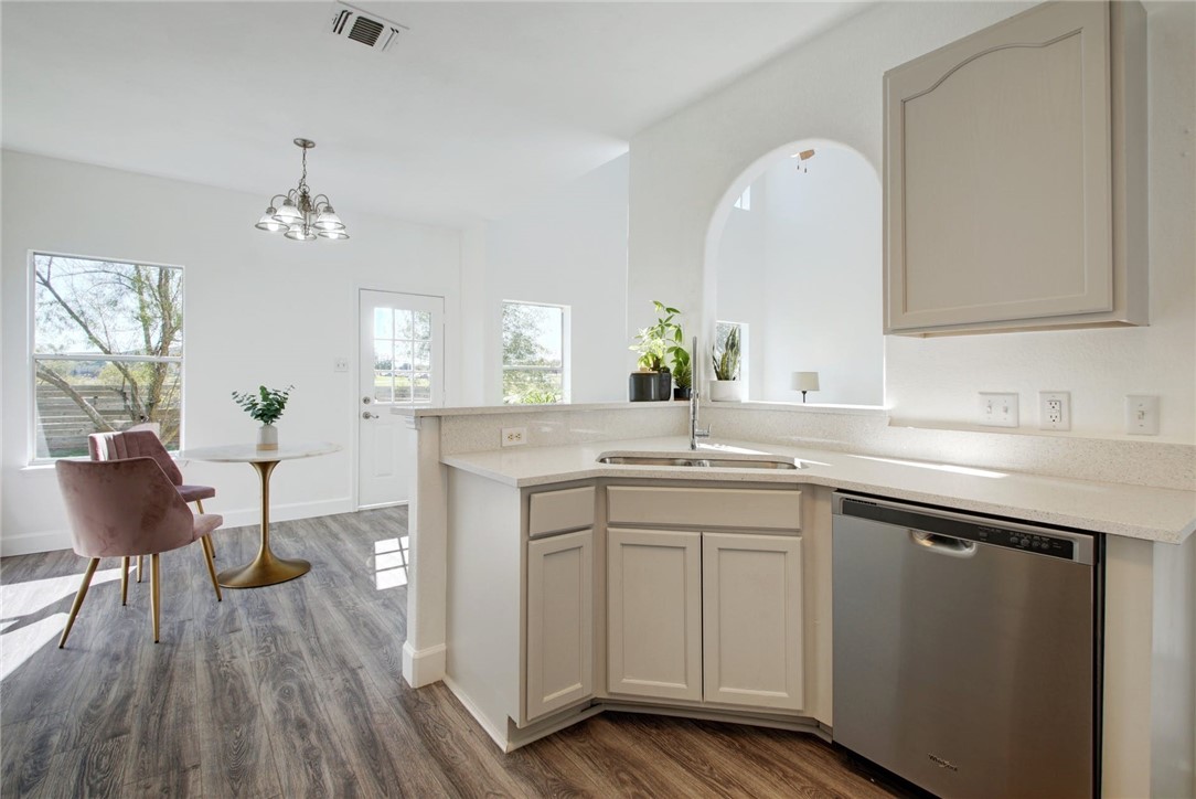 Kitchen is open to the living area but also just tucked away. Breakfast bar is the perfect conversation space. - If you have additional questions regarding 1160 Arbor Knot Drive  in Kyle or would like to tour the property with us call 800-660-1022 and reference MLS# 2394313.
