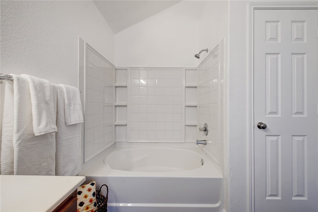 Primary bedroom en suite bath with linen closet and massive walk-in closet. - If you have additional questions regarding 1160 Arbor Knot Drive  in Kyle or would like to tour the property with us call 800-660-1022 and reference MLS# 2394313.