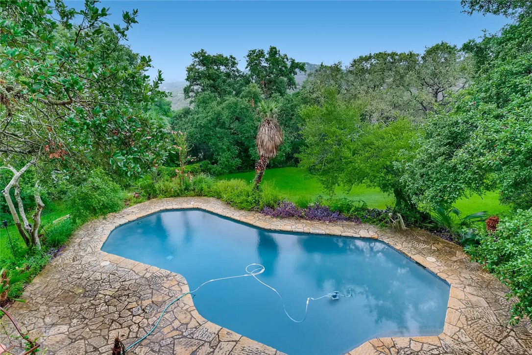 On a clear day, the property has skyline views through the trees. - If you have additional questions regarding 1355 The High Road  in Austin or would like to tour the property with us call 800-660-1022 and reference MLS# 6416687.