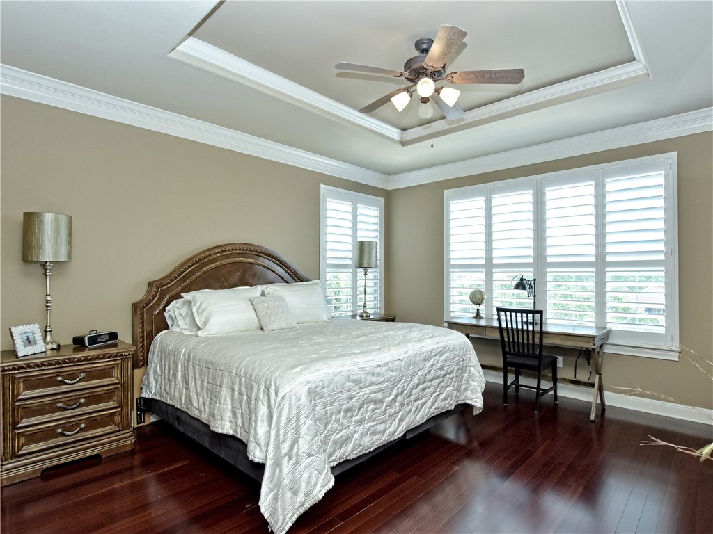 Large master bedroom with wood flooring and plantation shutters - If you have additional questions regarding 2609 Old Hickory Cove  in Austin or would like to tour the property with us call 800-660-1022 and reference MLS# 8871668.