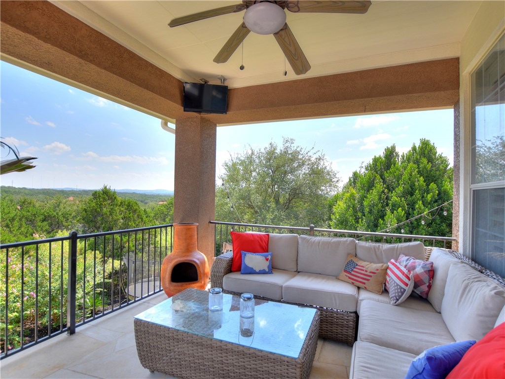 Upstairs porch with views for miles!  Always catches the breeze!  TV mounted in corner - If you have additional questions regarding 2609 Old Hickory Cove  in Austin or would like to tour the property with us call 800-660-1022 and reference MLS# 8871668.