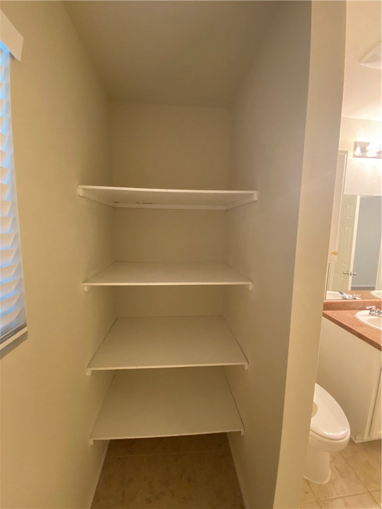 Shelves for storage in owner's suite bathroom - If you have additional questions regarding 9412 Southwick Drive  in Austin or would like to tour the property with us call 800-660-1022 and reference MLS# 4619893.