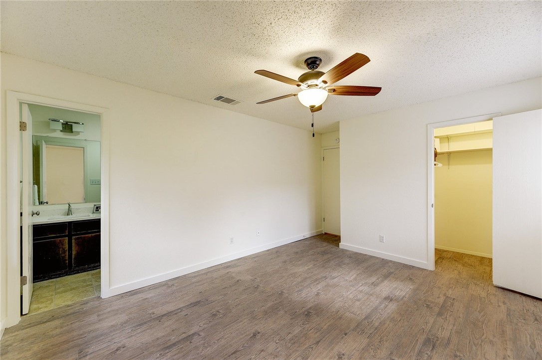 Another view of primary bedroom/f/k/a a master bedroom. - If you have additional questions regarding 7603 Whispering Winds Drive  in Austin or would like to tour the property with us call 800-660-1022 and reference MLS# 1592502.