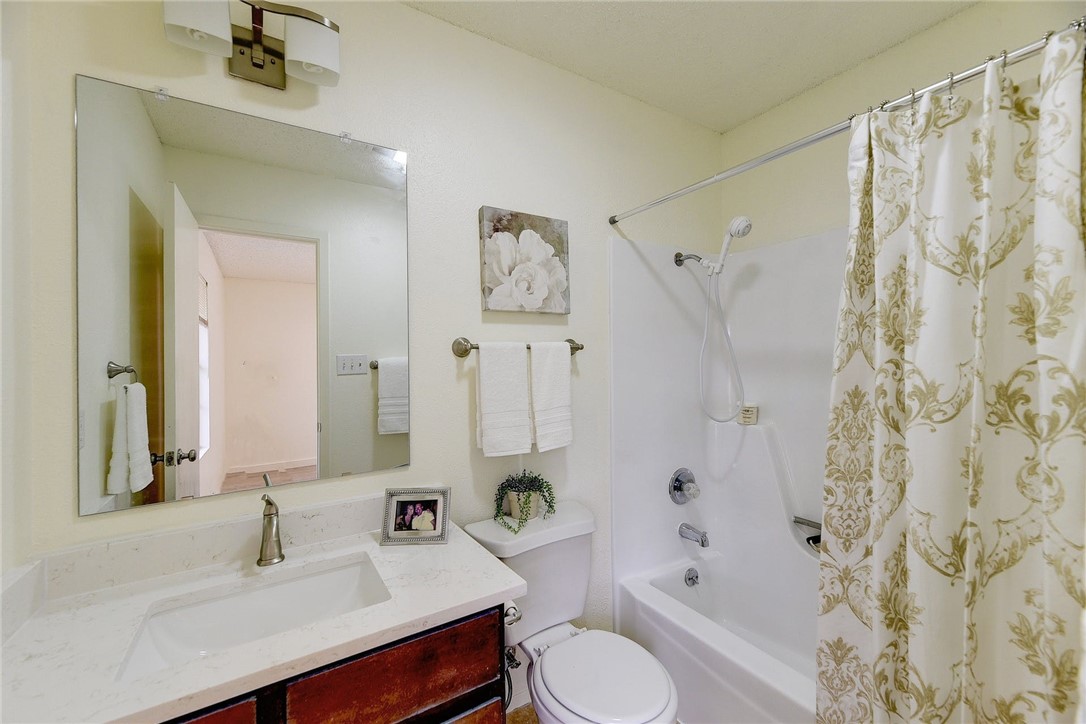Master/primary bathroom with new quartz marble vanity top - If you have additional questions regarding 7603 Whispering Winds Drive  in Austin or would like to tour the property with us call 800-660-1022 and reference MLS# 1592502.