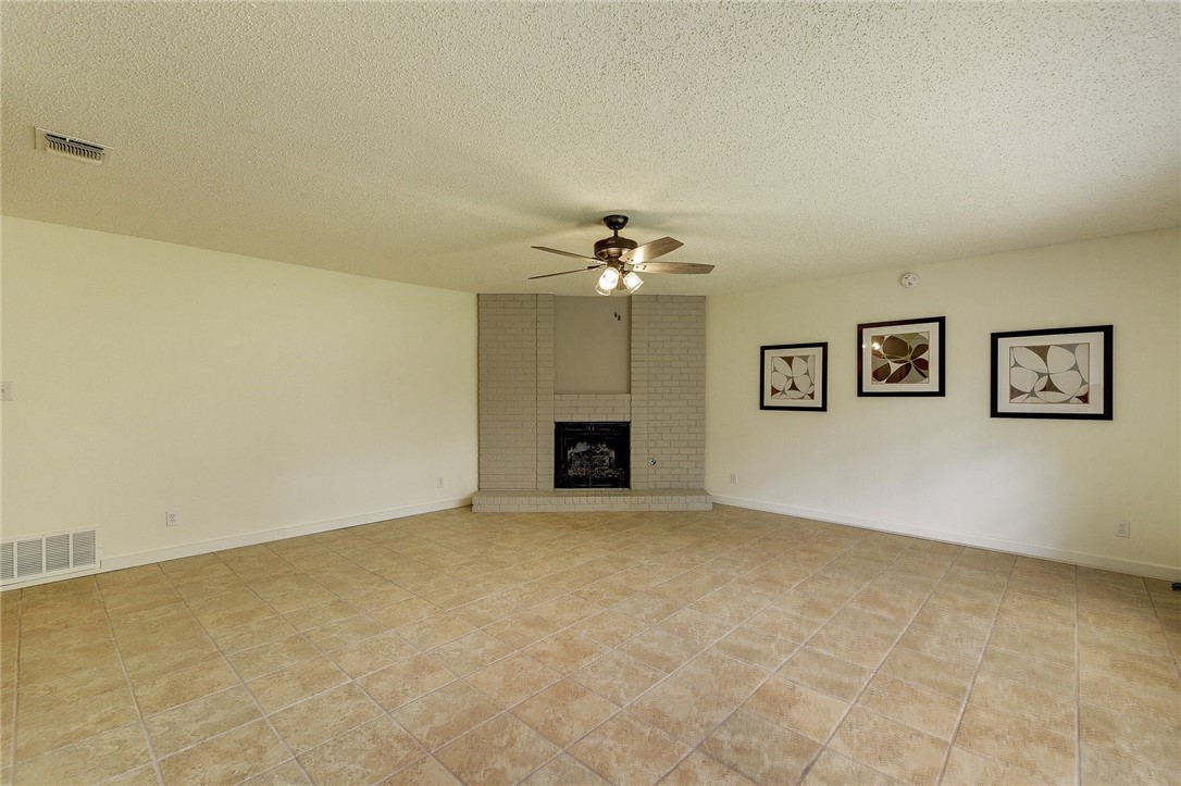 Another view of spacious living room. - If you have additional questions regarding 7603 Whispering Winds Drive  in Austin or would like to tour the property with us call 800-660-1022 and reference MLS# 1592502.
