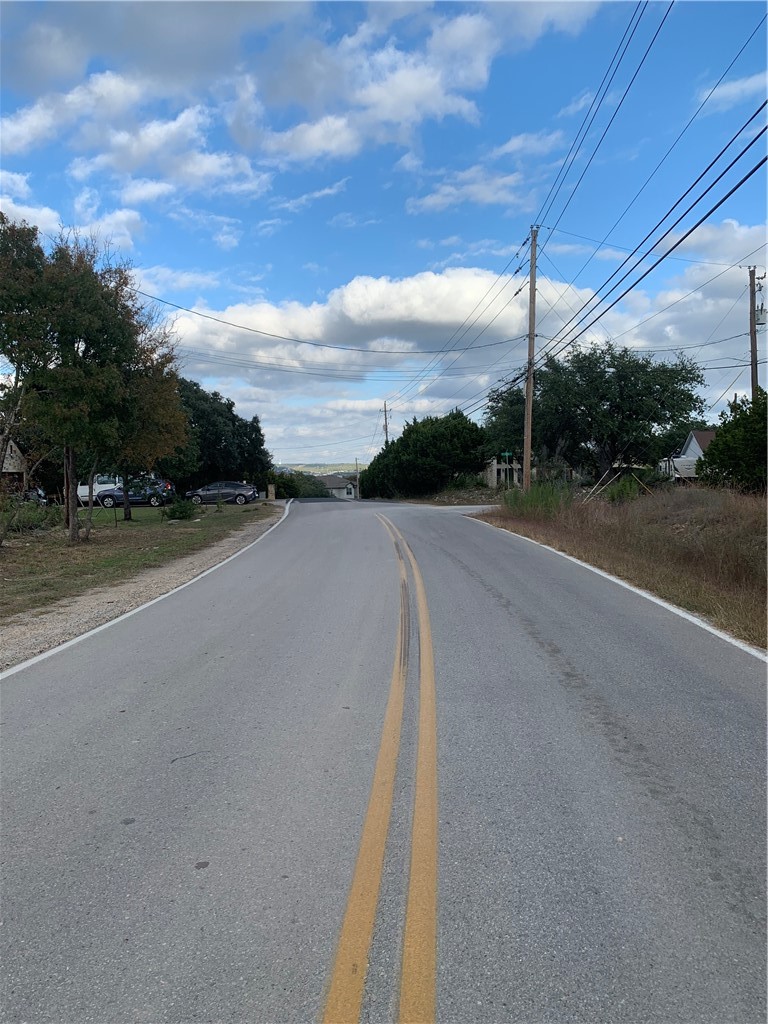 looking down road facing right towards lake austin. - If you have additional questions regarding 14500 Debba Drive  in Austin or would like to tour the property with us call 800-660-1022 and reference MLS# 7432522.