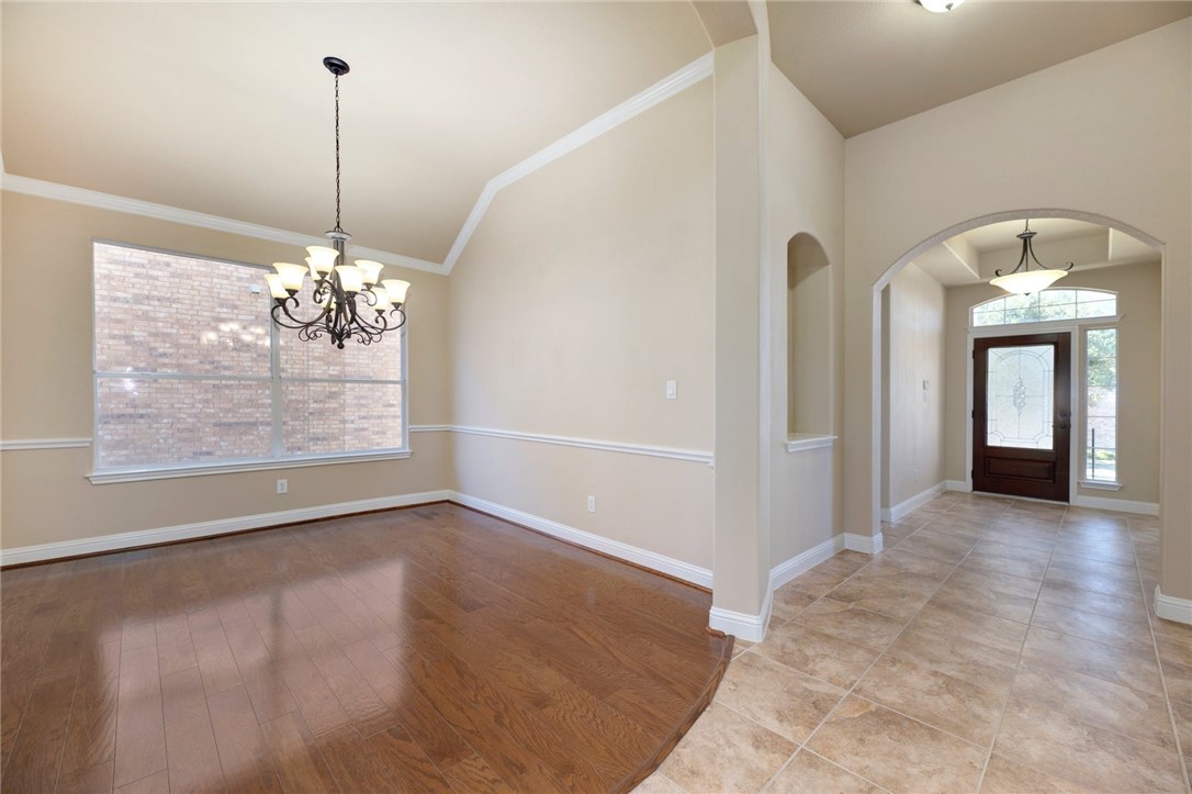 A look at the capacious formal dining room and the glamourous entrance foyer that features a tray ceiling. - If you have additional questions regarding 406 Ledge Stone Drive  in Austin or would like to tour the property with us call 800-660-1022 and reference MLS# 7092660.