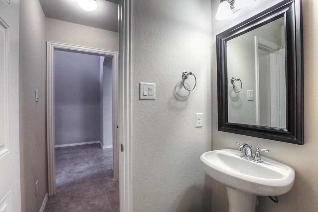 A half bath is tucked away off the front hall. An additional hall closet too. - If you have additional questions regarding 8206 Laughing Falcon Trail  in Conroe or would like to tour the property with us call 800-660-1022 and reference MLS# 26206209.
