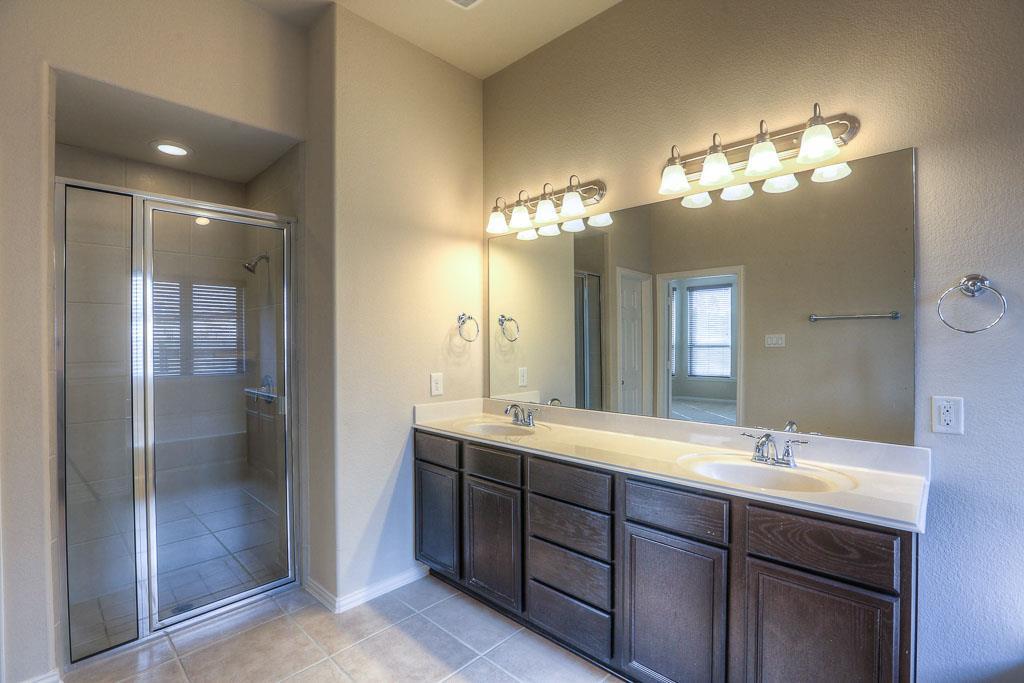 A large separate shower, two sinks and lots of storage in the master. - If you have additional questions regarding 8206 Laughing Falcon Trail  in Conroe or would like to tour the property with us call 800-660-1022 and reference MLS# 26206209.