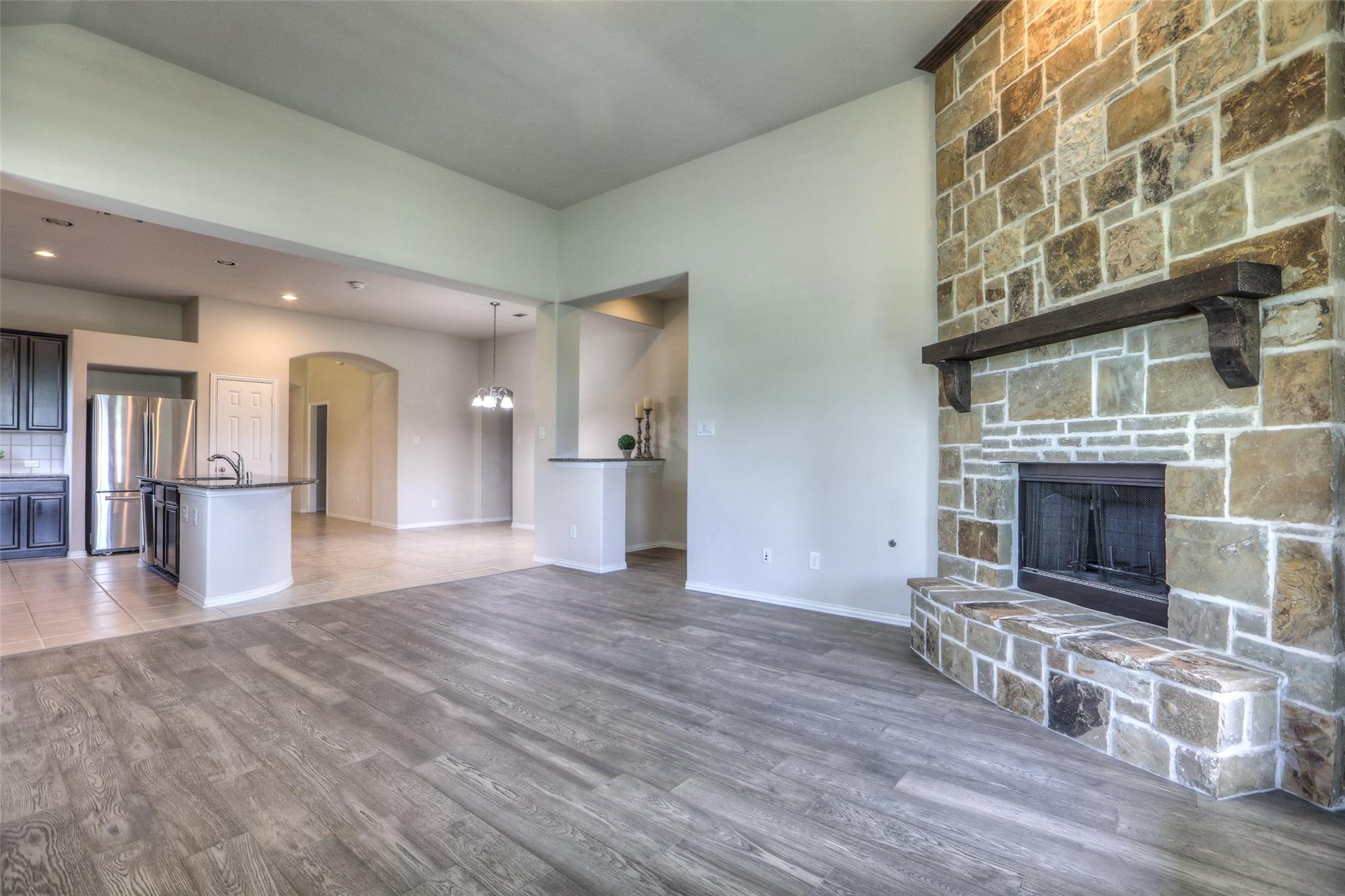 This home is loaded with upgrades including wood flooring and a stone fireplace! - If you have additional questions regarding 8206 Laughing Falcon Trail  in Conroe or would like to tour the property with us call 800-660-1022 and reference MLS# 26206209.