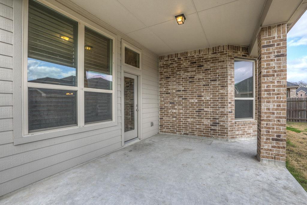 The covered patio is extended so there is room for everyone to relax. - If you have additional questions regarding 8206 Laughing Falcon Trail  in Conroe or would like to tour the property with us call 800-660-1022 and reference MLS# 26206209.