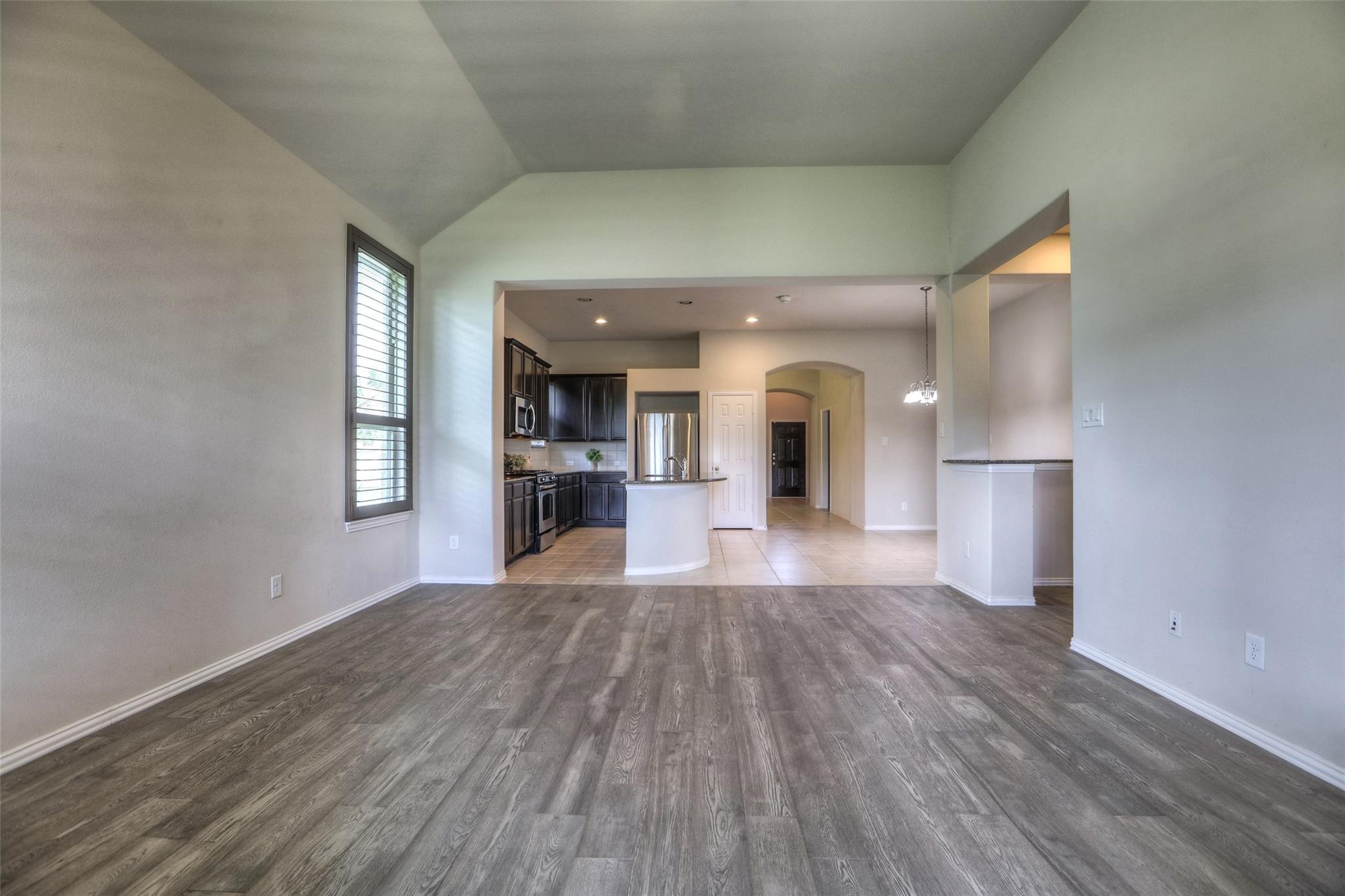 From the back of the home toward the front door. - If you have additional questions regarding 8206 Laughing Falcon Trail  in Conroe or would like to tour the property with us call 800-660-1022 and reference MLS# 26206209.