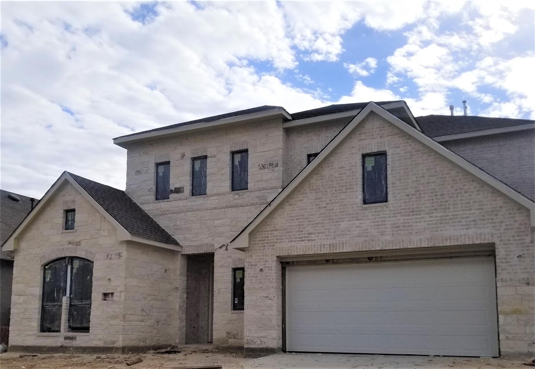 Actual photo of the Asher II currently under construction. - If you have additional questions regarding 15130 Botanical Garden Drive  in Conroe or would like to tour the property with us call 800-660-1022 and reference MLS# 65496158.