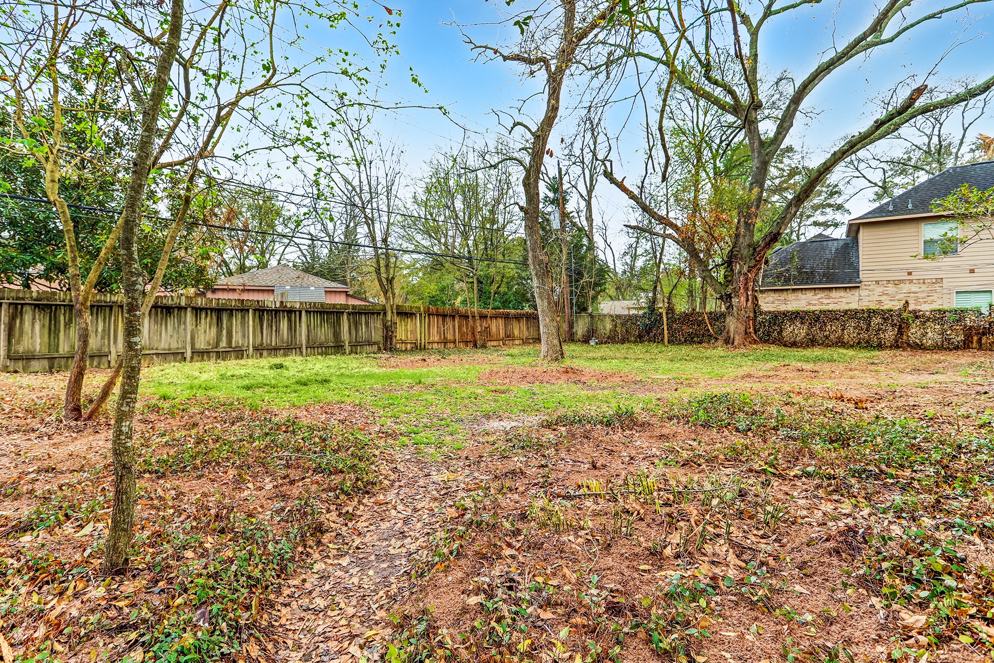 south west angle of the backyard - If you have additional questions regarding 11733 Joan of Arc Drive  in Houston or would like to tour the property with us call 800-660-1022 and reference MLS# 67674935.