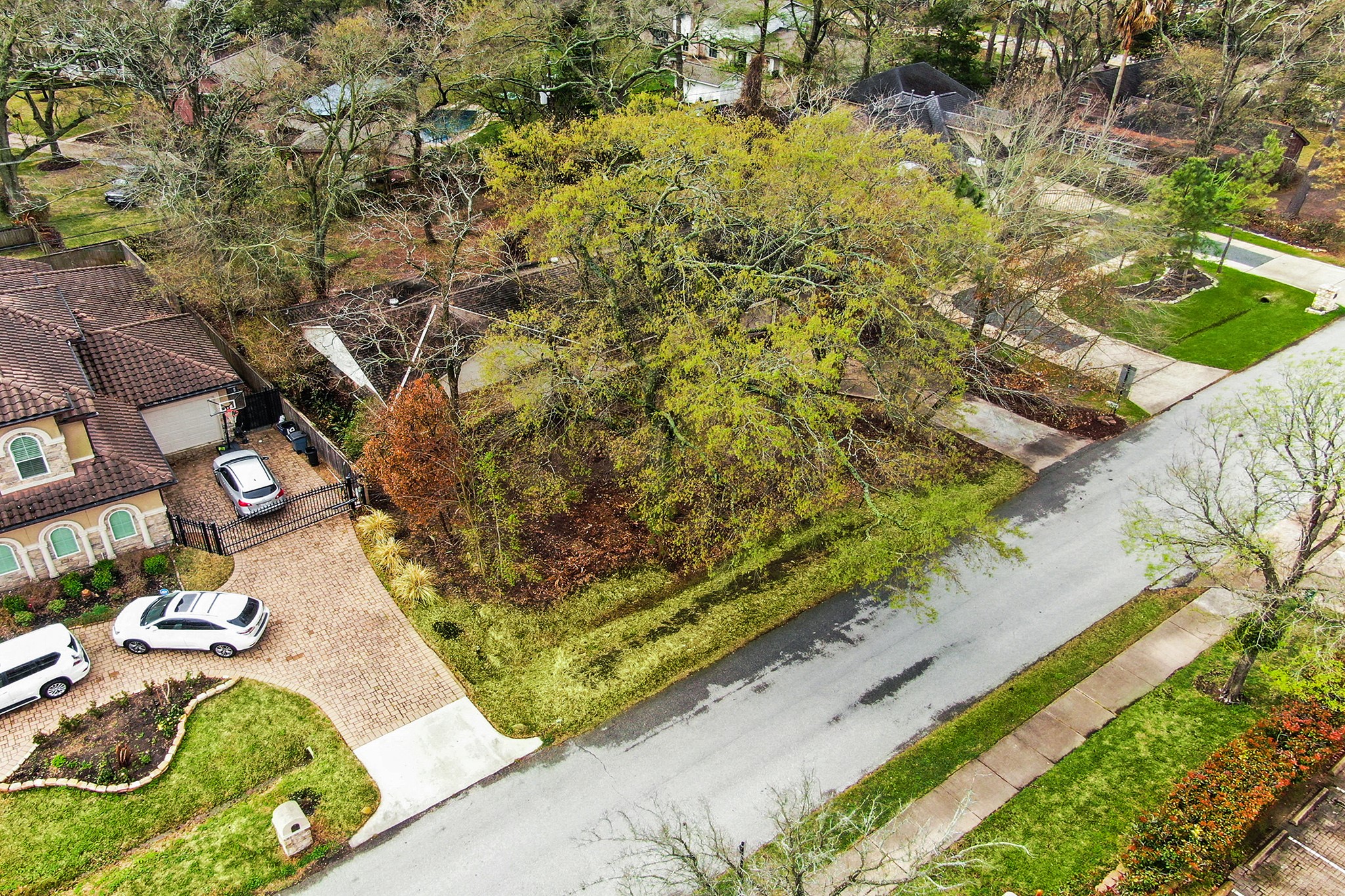 Aerial view of the property facing south west. - If you have additional questions regarding 11733 Joan of Arc Drive  in Houston or would like to tour the property with us call 800-660-1022 and reference MLS# 67674935.