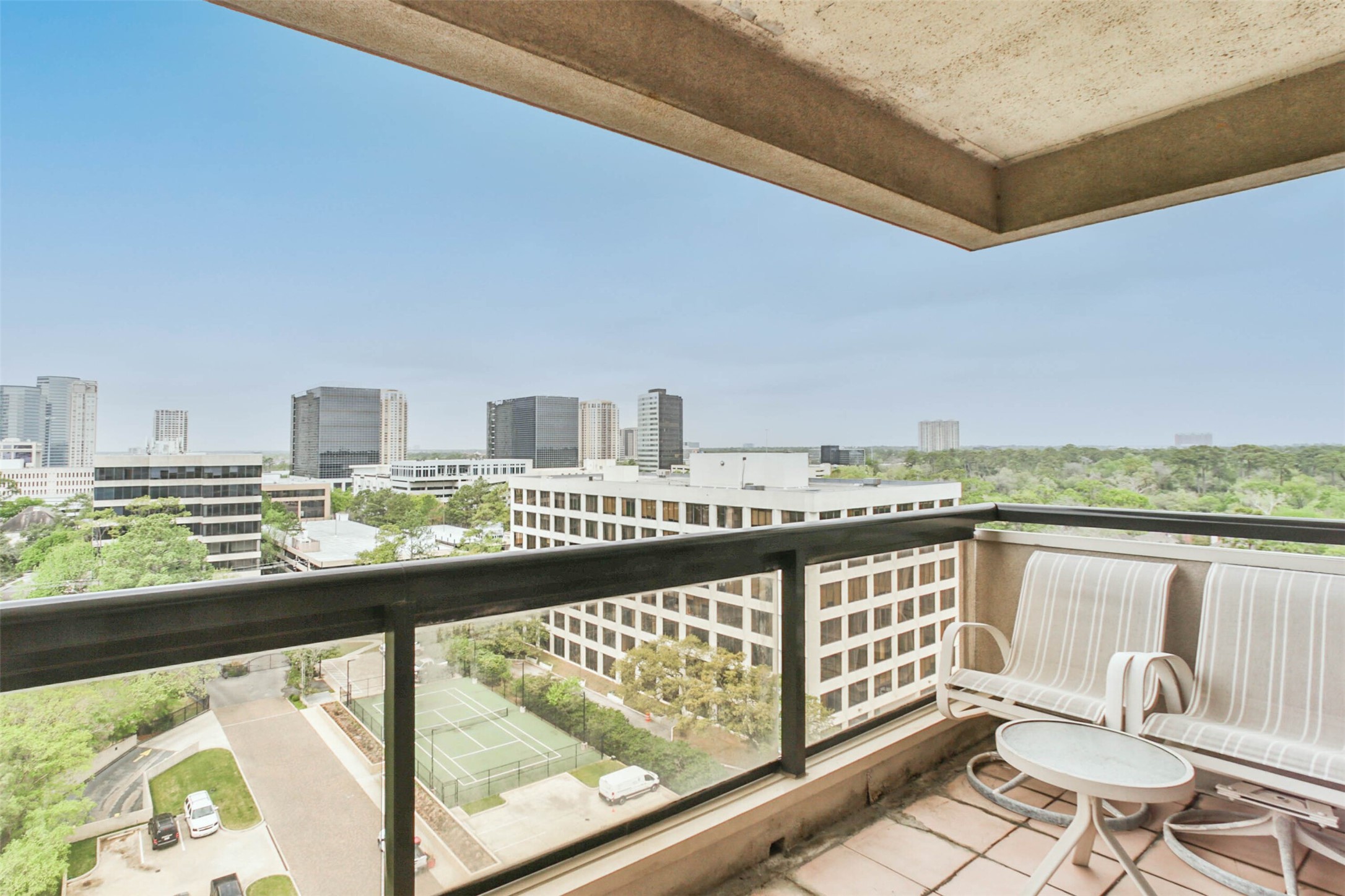 This is the view from one angle of your private, covered, outdoor patio. - If you have additional questions regarding 49 Briar Hollow Lane  in Houston or would like to tour the property with us call 800-660-1022 and reference MLS# 67039242.