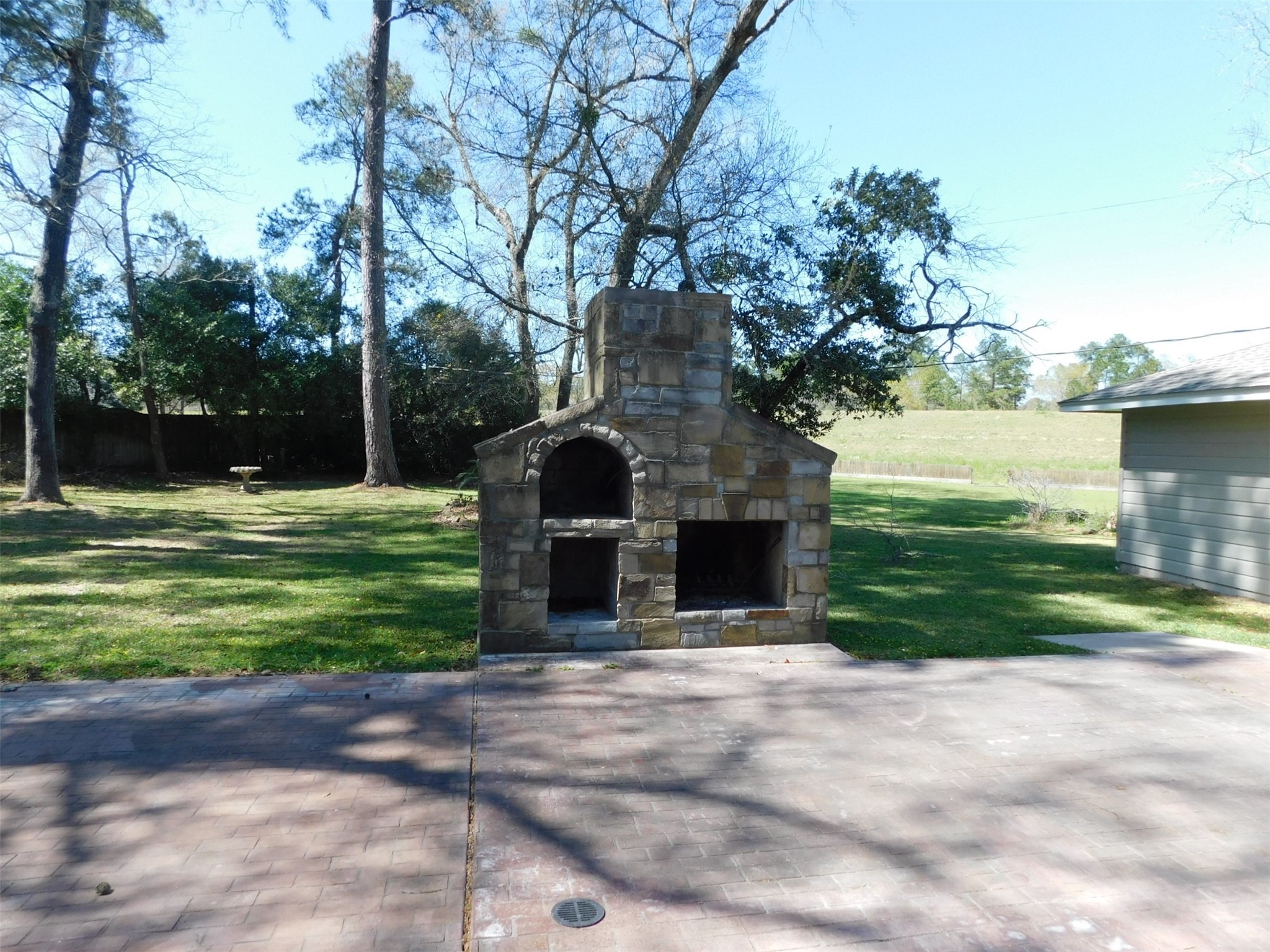 Fireplace back yard - If you have additional questions regarding 22411 Kenchester Drive  in Houston or would like to tour the property with us call 800-660-1022 and reference MLS# 39566226.