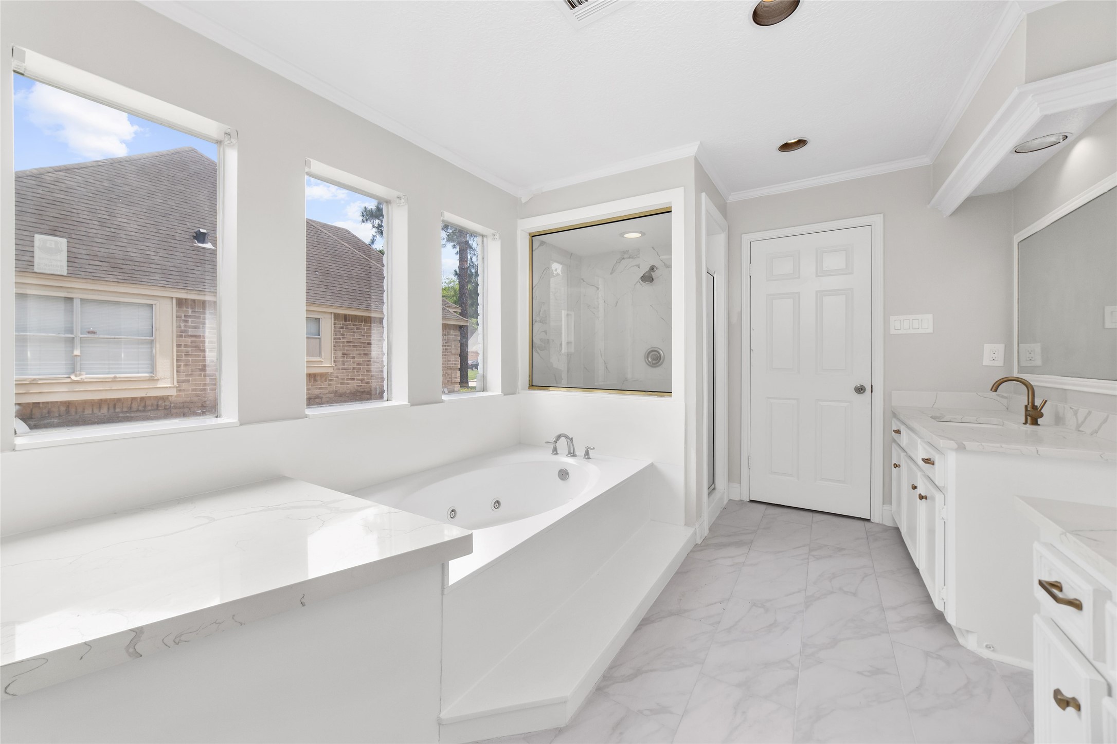 Master bathroom with jetted tub and separate standing shower - If you have additional questions regarding 22506 Wetherburn Lane  in Katy or would like to tour the property with us call 800-660-1022 and reference MLS# 96980135.