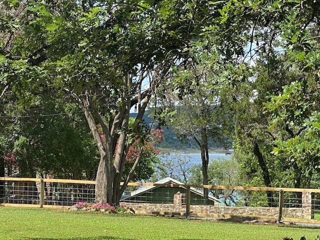 Views of Lake Travis from front yard area of home. - If you have additional questions regarding 16301 E Lake Shore Drive  in Austin or would like to tour the property with us call 800-660-1022 and reference MLS# 7548762.