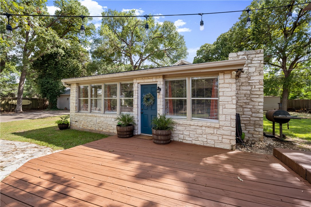 Front entryway to main house has huge outdoor wood deck for entertaining or just relaxing. - If you have additional questions regarding 16301 E Lake Shore Drive  in Austin or would like to tour the property with us call 800-660-1022 and reference MLS# 7548762.