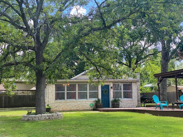 Main House has metal roof, stone & wood exterior and is open and bright. - If you have additional questions regarding 16301 E Lake Shore Drive  in Austin or would like to tour the property with us call 800-660-1022 and reference MLS# 7548762.