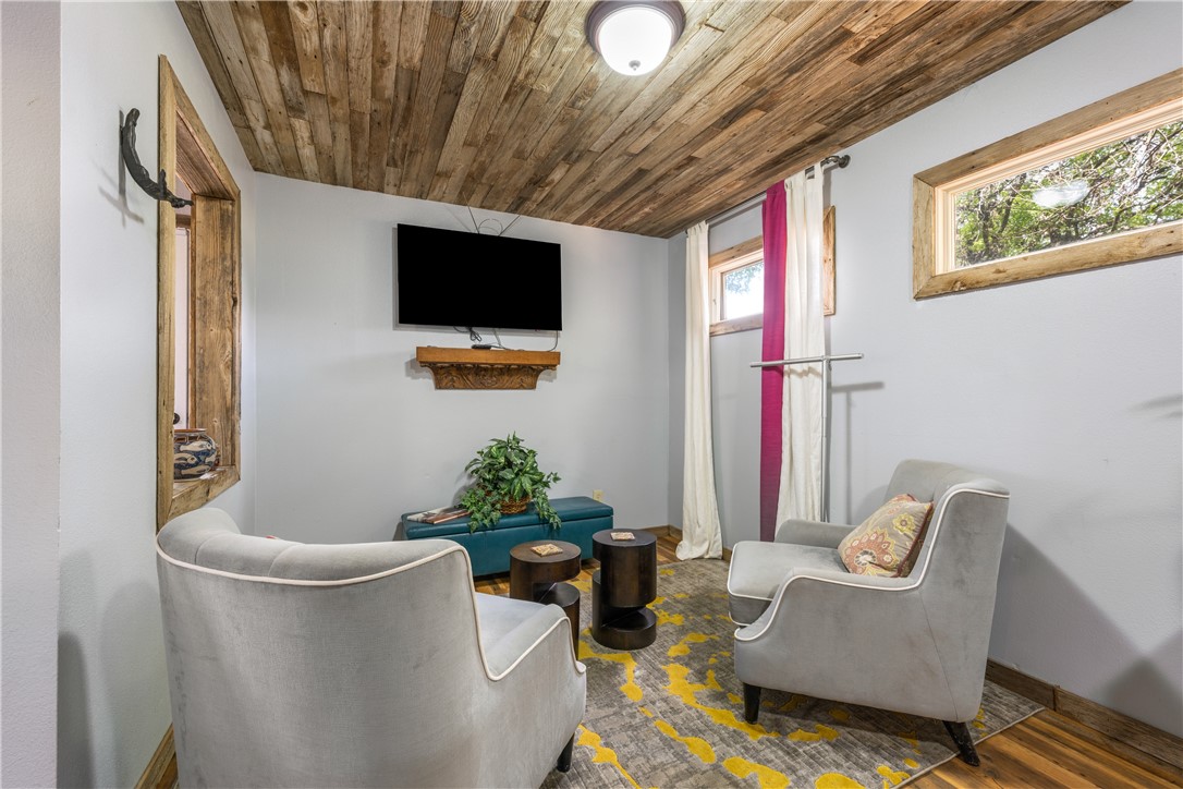 Guest cottage living room area has room for guests to relax and unwind after a long day. - If you have additional questions regarding 16301 E Lake Shore Drive  in Austin or would like to tour the property with us call 800-660-1022 and reference MLS# 7548762.