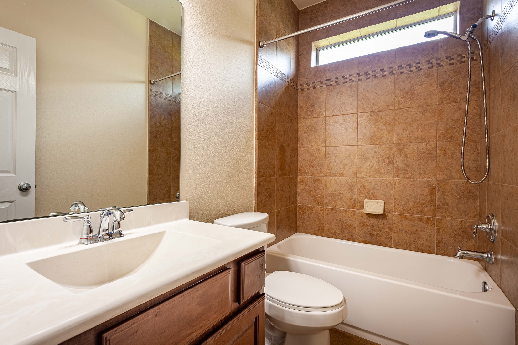 Front bathroom includes shower/tub with natural light. - If you have additional questions regarding 2404 Lakeway Drive  in Friendswood or would like to tour the property with us call 800-660-1022 and reference MLS# 35819457.