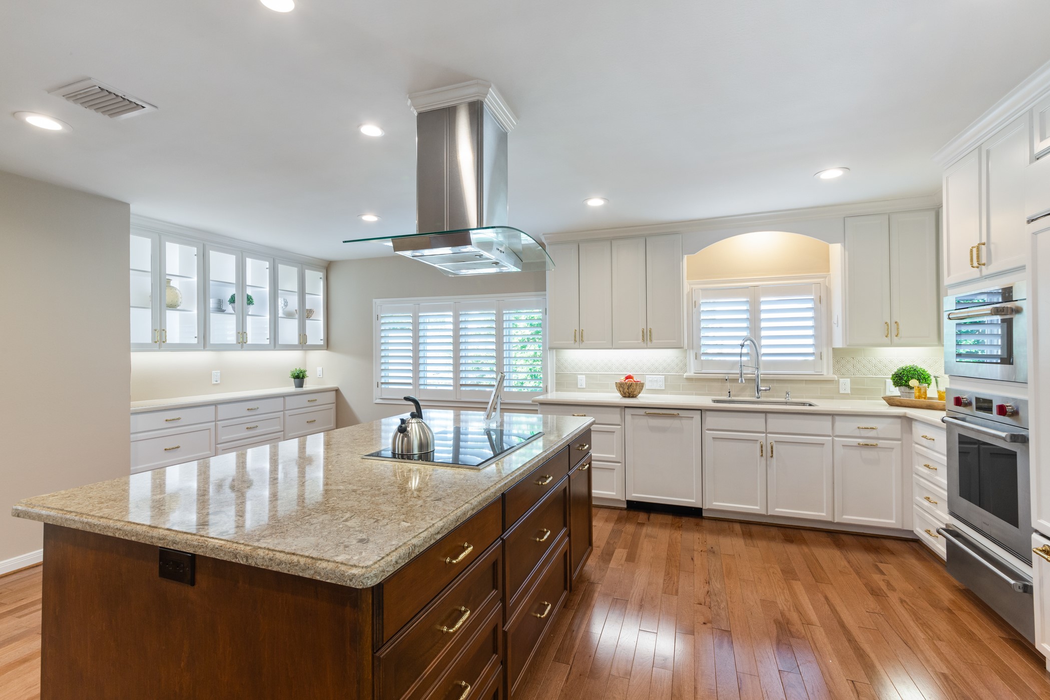 Built in refrigerator and dishwasher blend into the beautiful custom cabinetry. - If you have additional questions regarding 5207 Braesvalley Drive  in Houston or would like to tour the property with us call 800-660-1022 and reference MLS# 44144550.