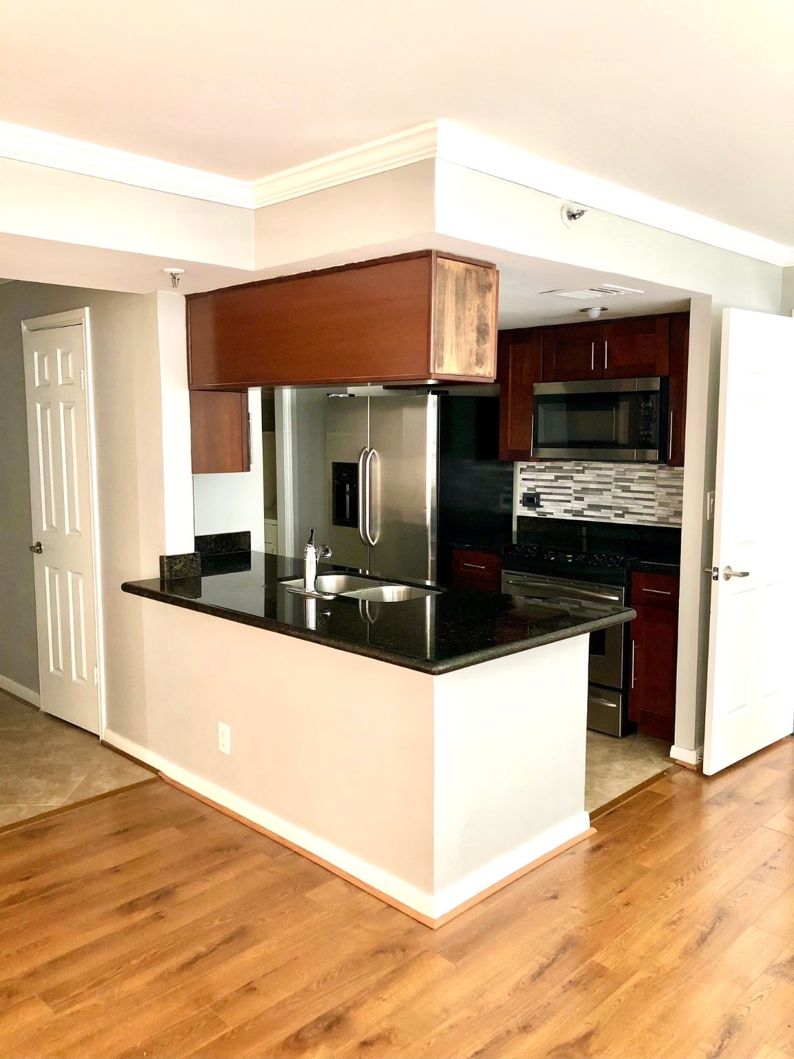Breakfast bar with plenty of cabinet storage. - If you have additional questions regarding 3525 Sage Road  in Houston or would like to tour the property with us call 800-660-1022 and reference MLS# 79115123.