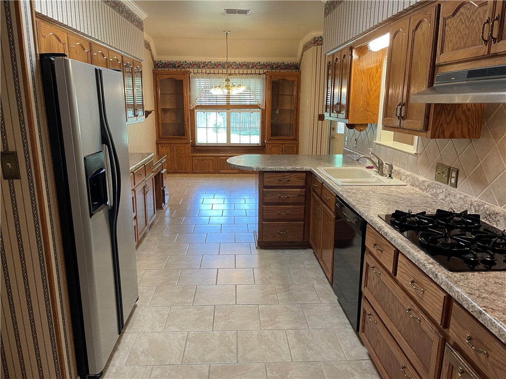 Spacious galley kitchen area with custom built cabinets.  Fridge conveys. - If you have additional questions regarding 1902 Hidden Meadow Drive  in Taylor or would like to tour the property with us call 800-660-1022 and reference MLS# 8916959.