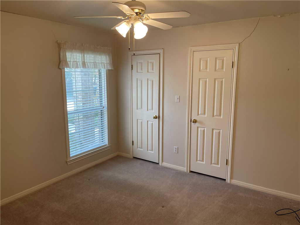 Front bedroom with large closet/storage space. - If you have additional questions regarding 1902 Hidden Meadow Drive  in Taylor or would like to tour the property with us call 800-660-1022 and reference MLS# 8916959.