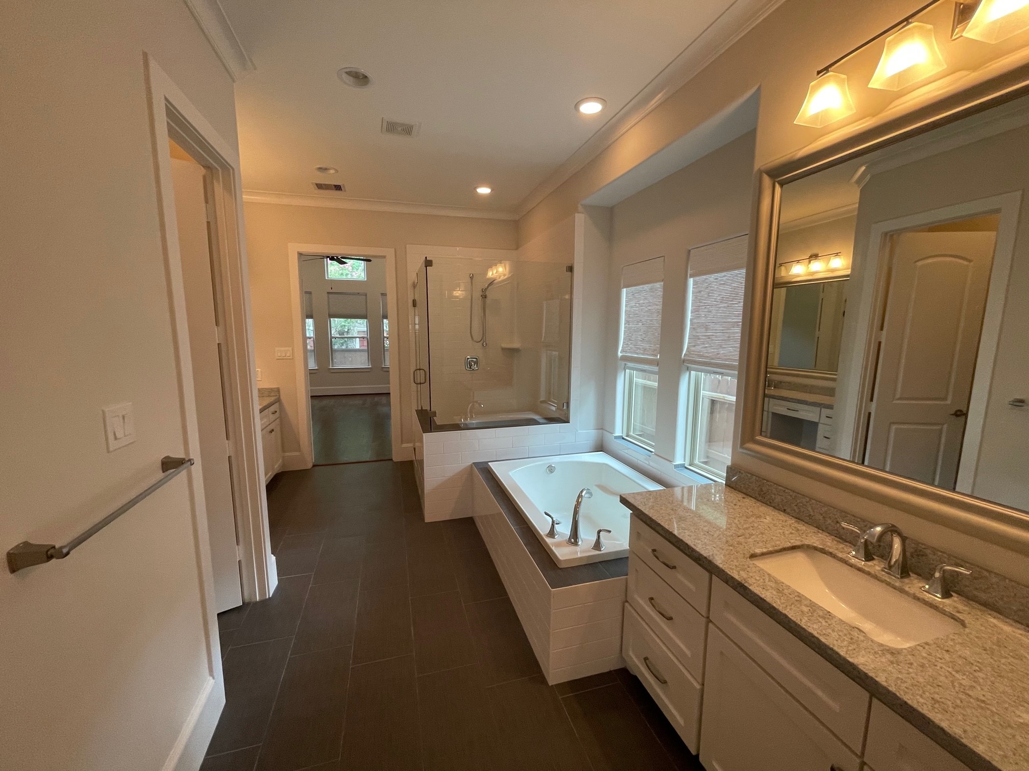 Lovely Master Bath features his and hers vanities, Soaking Tub and walk in shower w bench. - If you have additional questions regarding 5506 Ariel Street  in Houston or would like to tour the property with us call 800-660-1022 and reference MLS# 34676977.