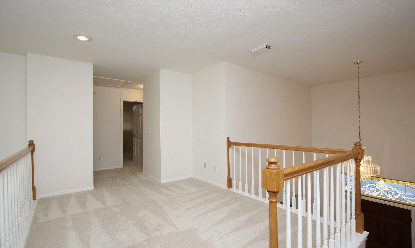 Walkway/balcony leading to upstairs bathrooms. Plenty of room for bookcases, chairs or small desk. - If you have additional questions regarding 8403 Colony Oaks Court  in Spring or would like to tour the property with us call 800-660-1022 and reference MLS# 21930324.