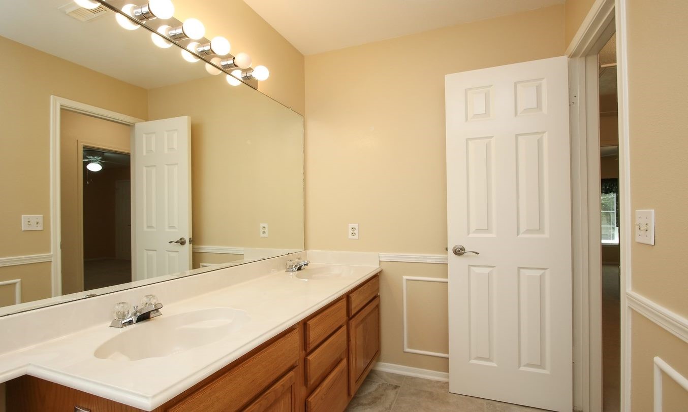 Large double sink vanity on second floor. - If you have additional questions regarding 8403 Colony Oaks Court  in Spring or would like to tour the property with us call 800-660-1022 and reference MLS# 21930324.