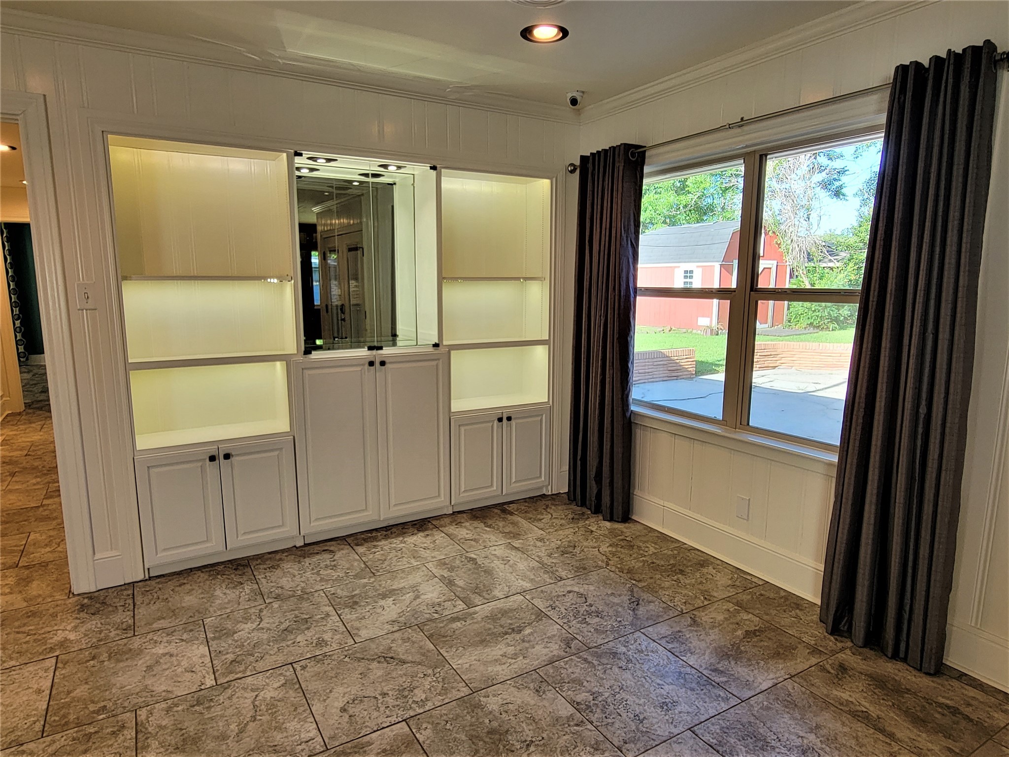 3/4 Inch Tongue and Grove Mahagony Panels in the Livingroom with Built in Cabinets - If you have additional questions regarding 1011 Lynnwood Avenue  in Liberty or would like to tour the property with us call 800-660-1022 and reference MLS# 98715194.