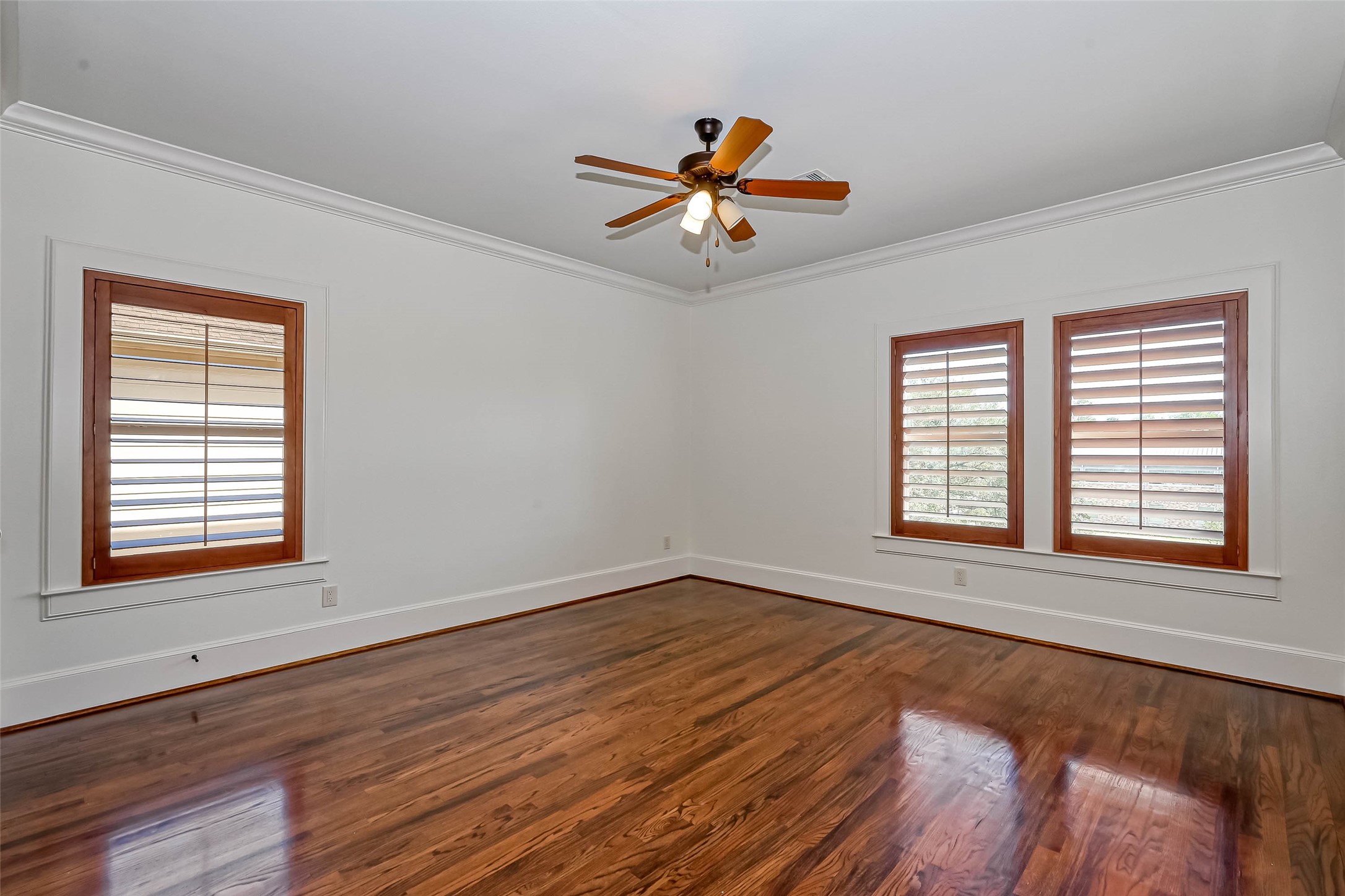 2nd bedroom on the 3rd floor with custom shutters, wood flooring and an ensuite bathroom - If you have additional questions regarding 6606 Rodrigo Street  in Houston or would like to tour the property with us call 800-660-1022 and reference MLS# 74006082.