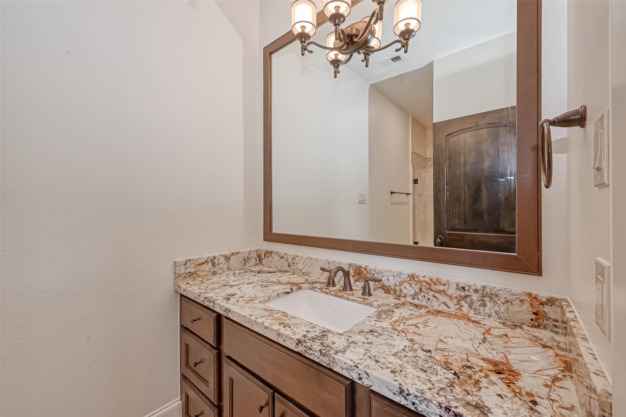 Vanity in the 2nd bathroom with granite counters - If you have additional questions regarding 6606 Rodrigo Street  in Houston or would like to tour the property with us call 800-660-1022 and reference MLS# 74006082.
