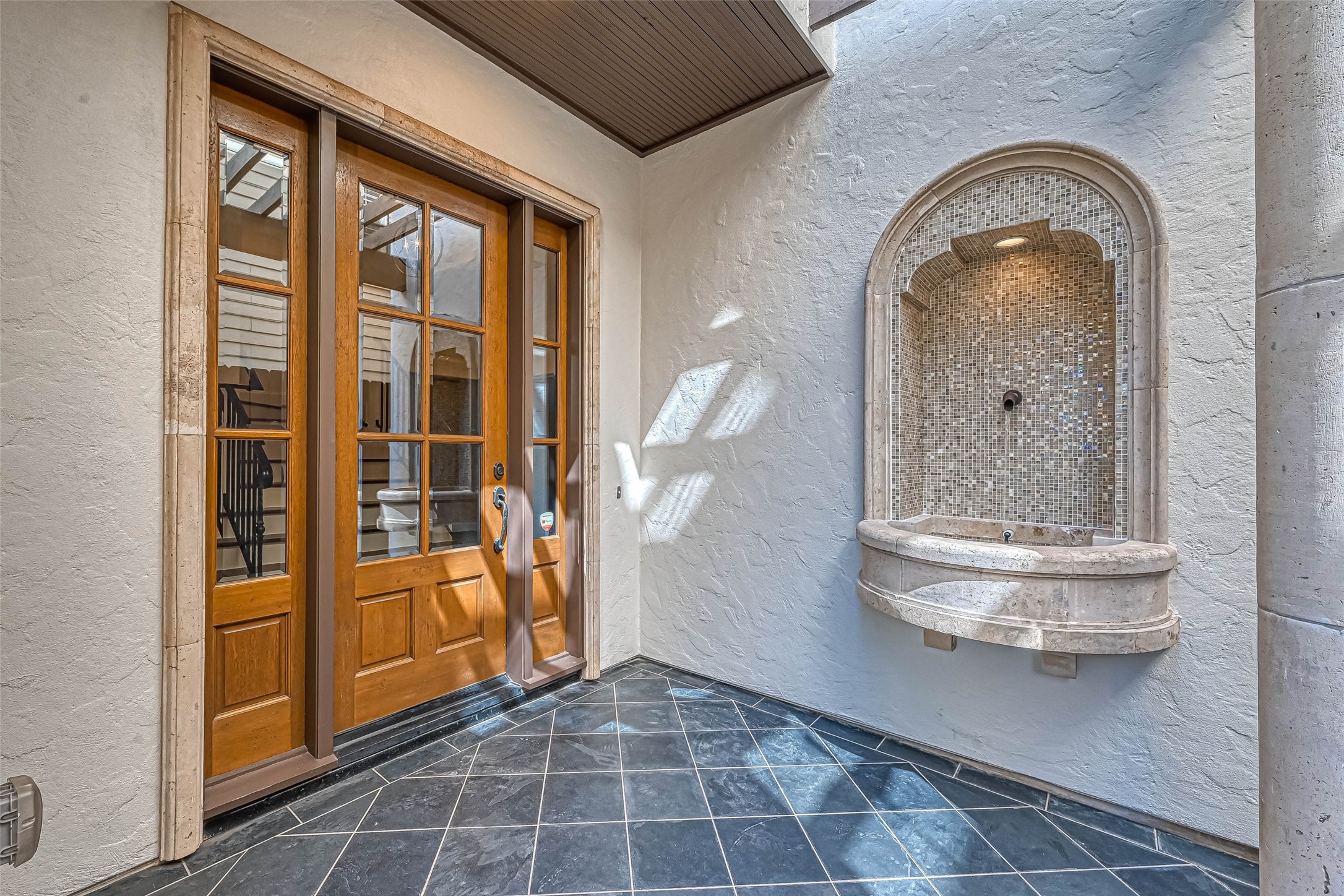 Lovely front door with calming water fountain - If you have additional questions regarding 6606 Rodrigo Street  in Houston or would like to tour the property with us call 800-660-1022 and reference MLS# 74006082.