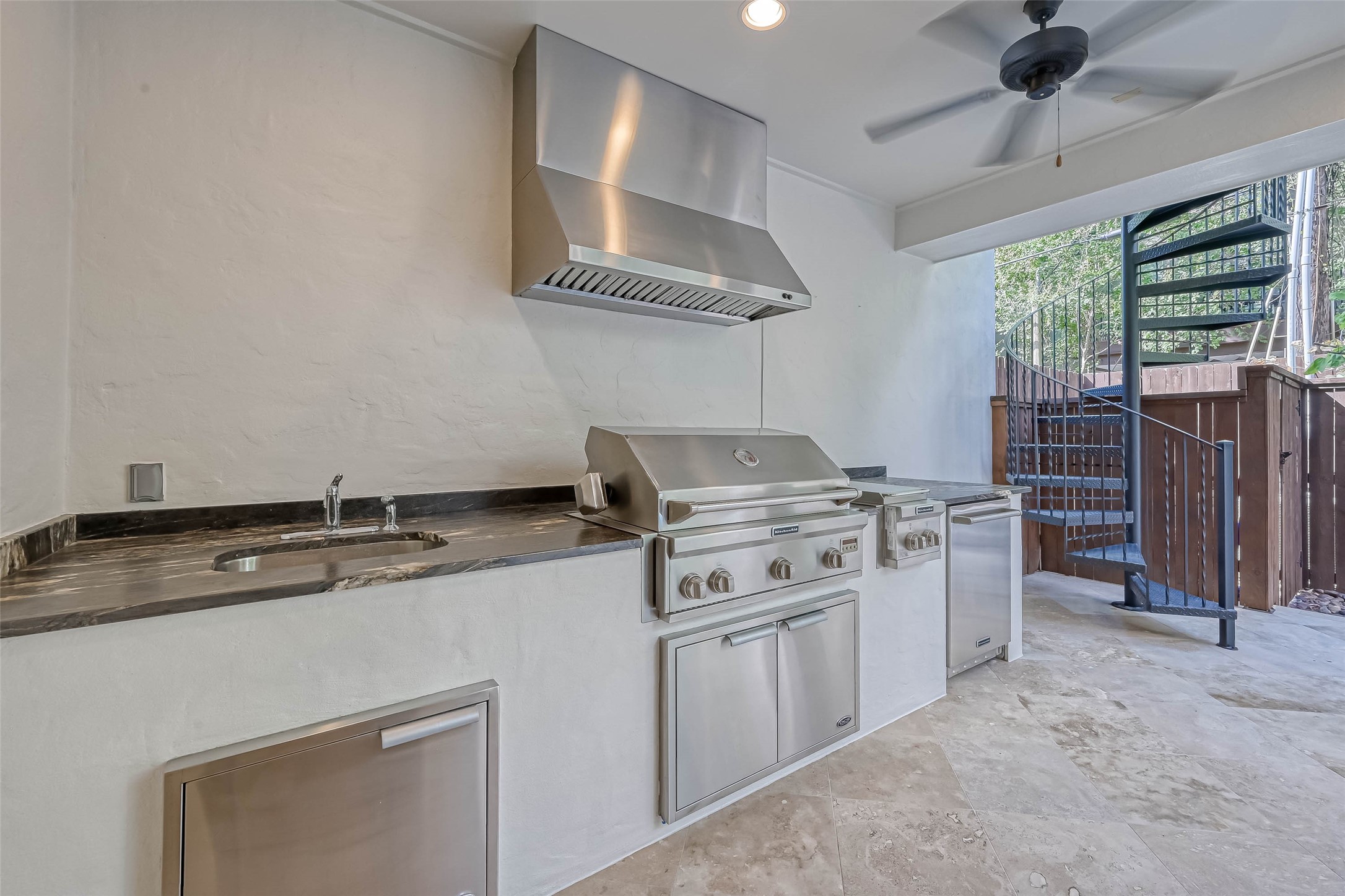 Another view of the outdoor kitchen with granite counters - If you have additional questions regarding 6606 Rodrigo Street  in Houston or would like to tour the property with us call 800-660-1022 and reference MLS# 74006082.
