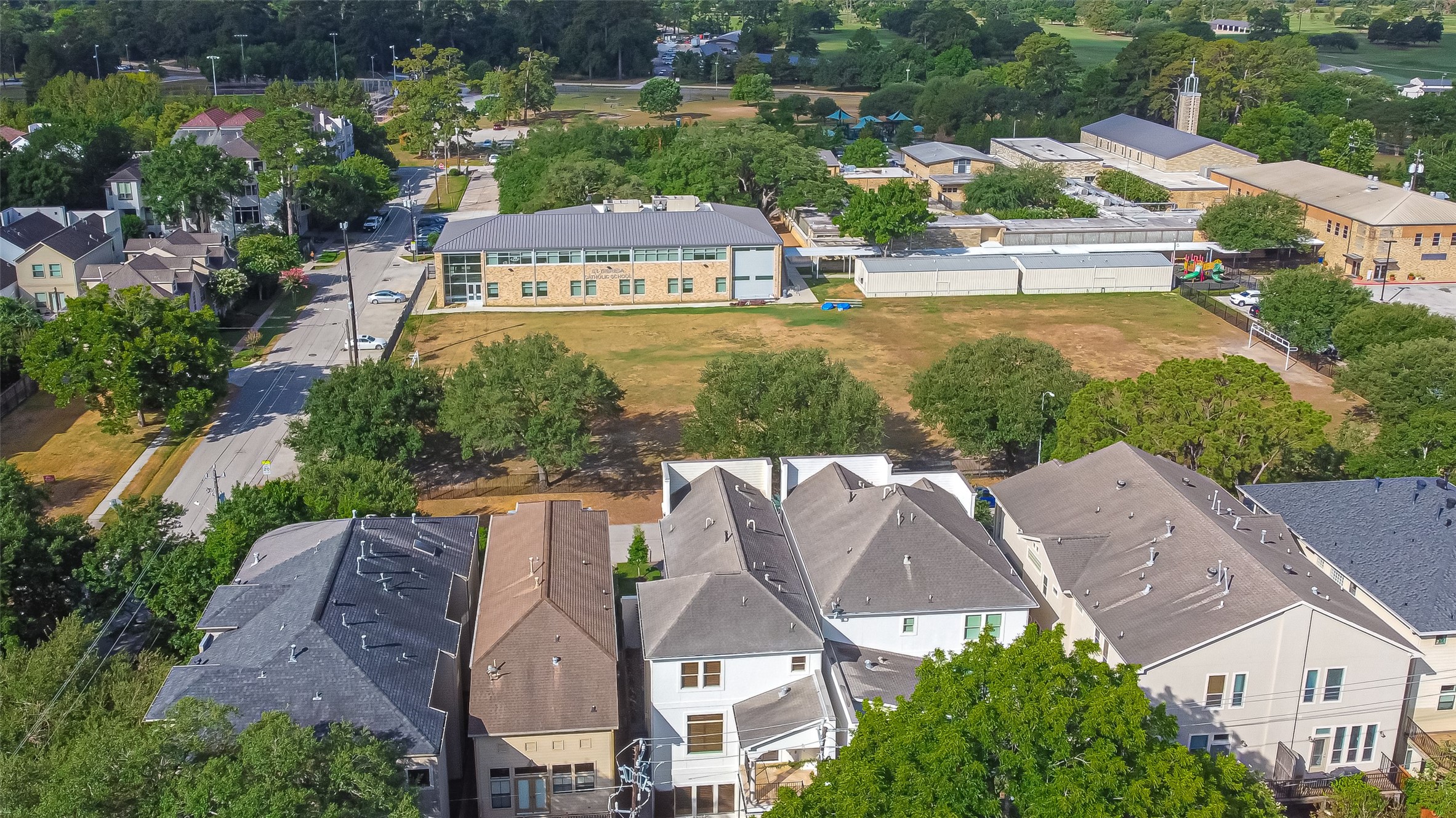 View directly in front of this beautiful home, St. Teresa's School grounds - If you have additional questions regarding 6606 Rodrigo Street  in Houston or would like to tour the property with us call 800-660-1022 and reference MLS# 74006082.