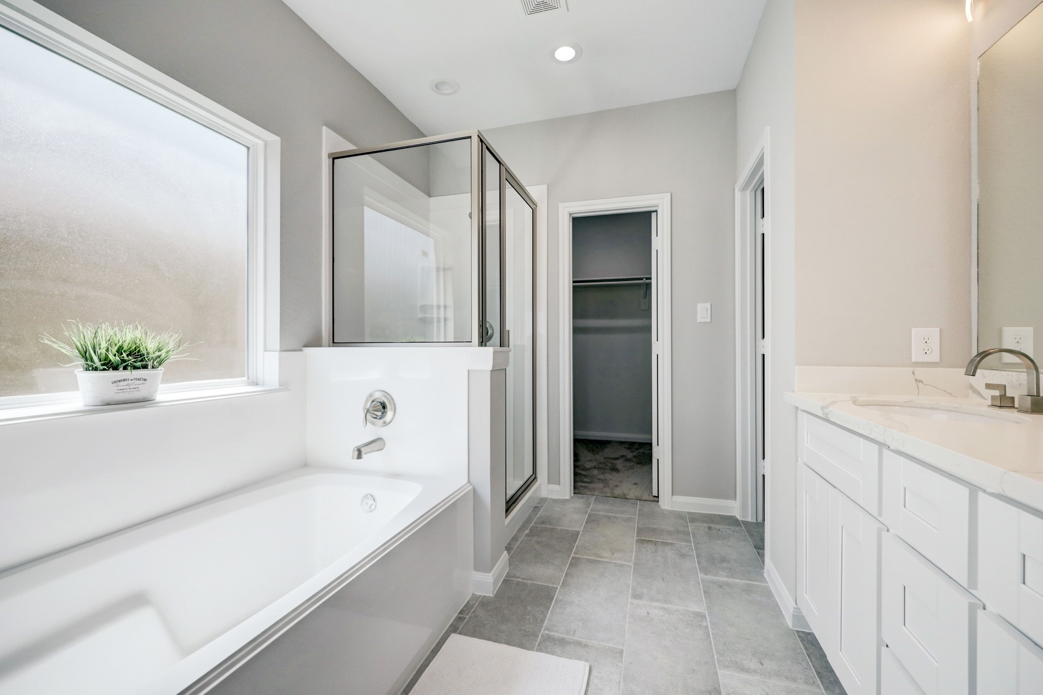 The Primary bath features a soaking tub and shower as well as a double vanity. Pictures are of the model home. - If you have additional questions regarding 8106 James Franklin Street  in Houston or would like to tour the property with us call 800-660-1022 and reference MLS# 70741946.